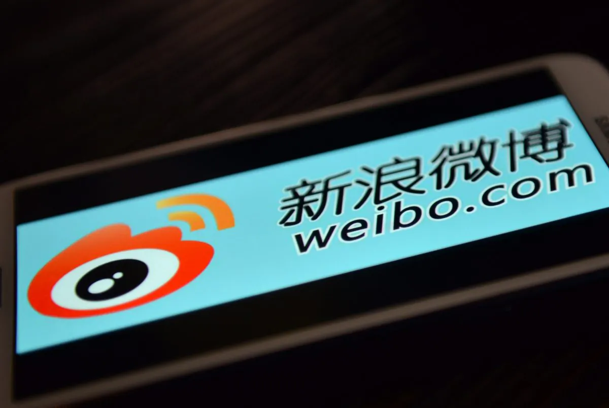 The logo of Chinese microblogging site Sina Weibo on a cellphone on March 19, 2014. (Peter Parks/AFP/Getty Images)