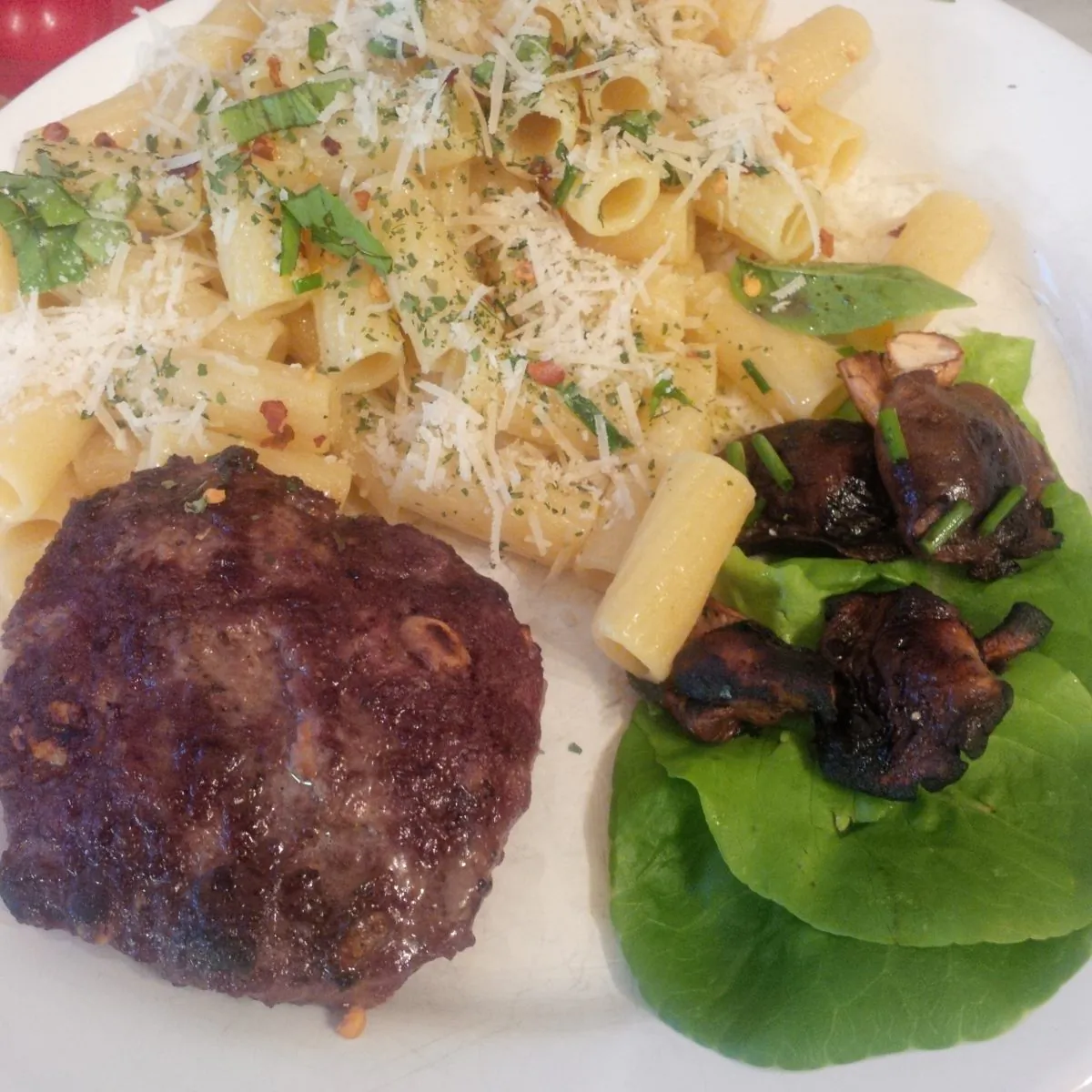 Mushrooms in lettuce cups served with pasta and grilled lamb patties. (Pierre Hallett)