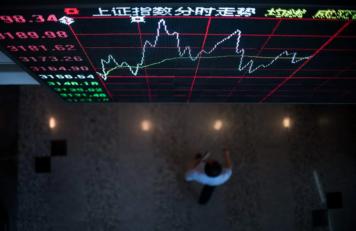 A board shows the stock movements inside the Shanghai Stock Exchange in the Lujiazui Financial district of Shanghai on Sept. 22, 2015. (Johannes Eisele/AFP/Getty Images)