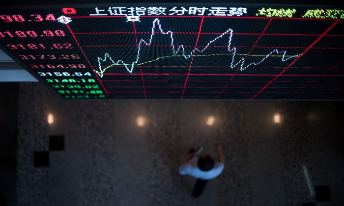 A board shows the stock movements inside the Shanghai Stock Exchange in the Lujiazui Financial district of Shanghai on Sept. 22, 2015. (Johannes Eisele/AFP/Getty Images)