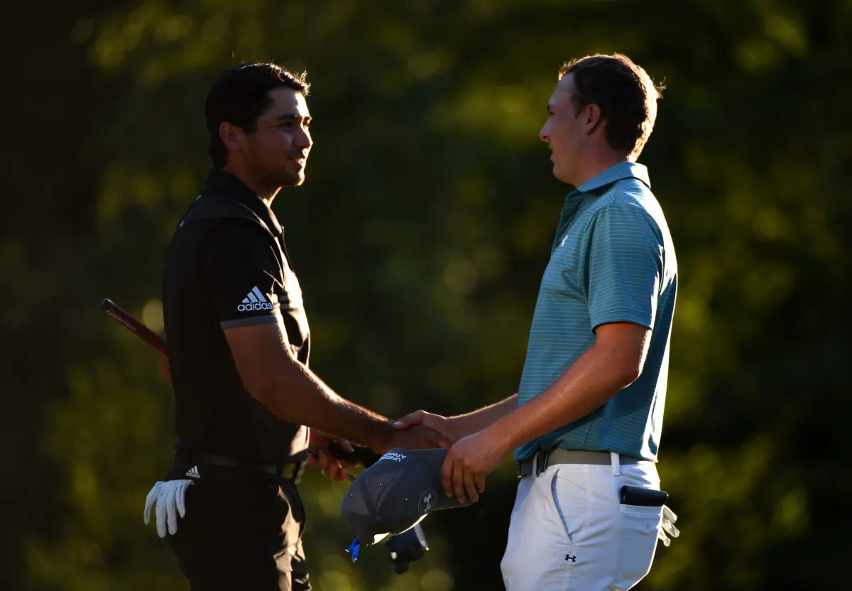 Jason Day of Australia and Jordan Spieth shake hand on the 18th green during round two of the Deutsche Bank Championship at TPC Boston. (Ross Kinnaird/Getty Images)
