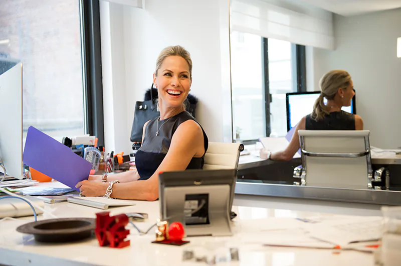 Suelyn in her office in New York. Suelyn is wearing a Proenza Schouler top.
