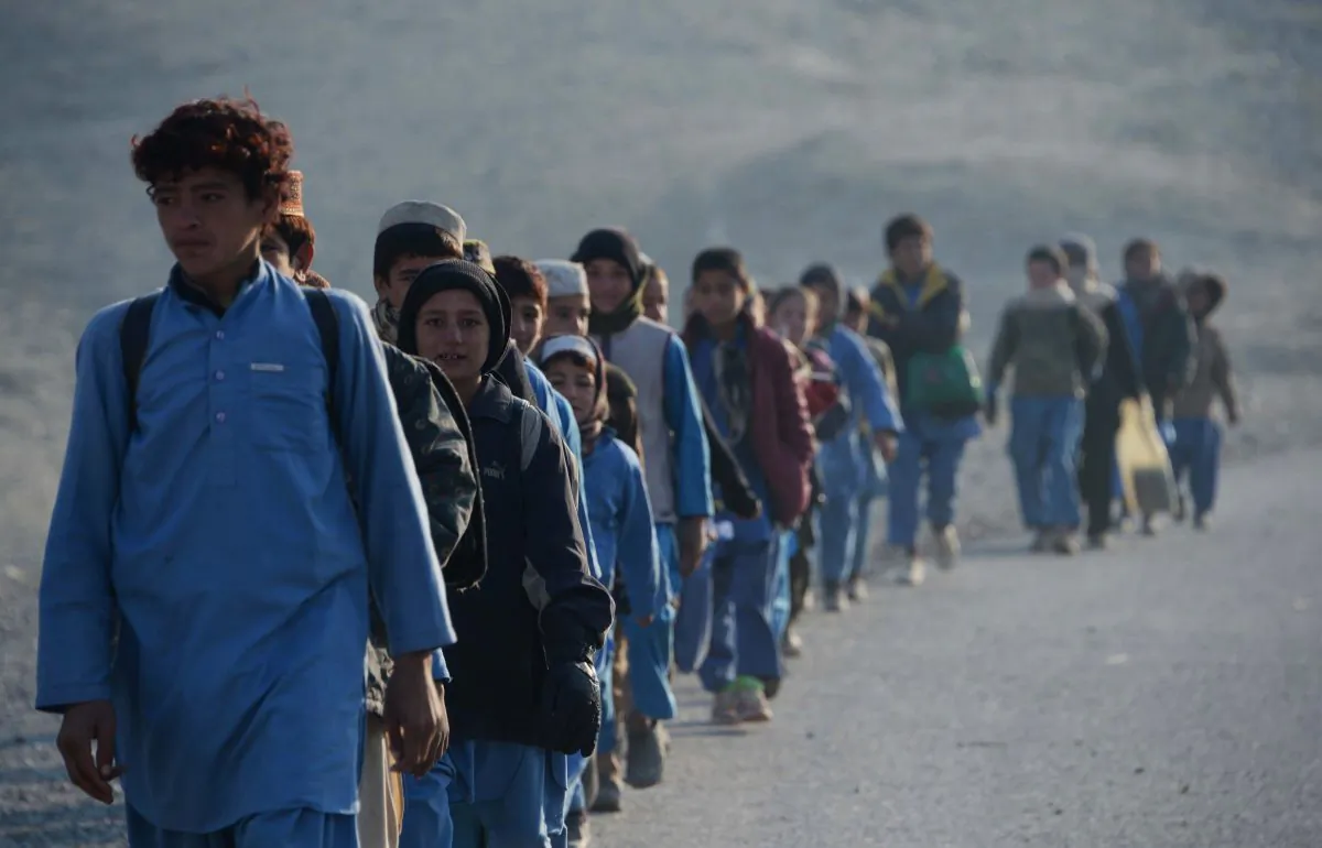 Afghan schoolchildren leave after studying at an open-air classroom in the Mohmand Dara district in eastern Nangarhar Province, on Dec. 18, 2014. Afghanistan has had only rare moments of peace over the past 30 years, its education system undermined by the Soviet invasion of 1979, a civil war in the 1990s, and six years of Taliban rule. (Noorullah Shirzada/AFP/Getty Images)