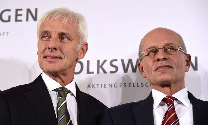 (L-R) Matthias Mueller, head of German automaker Porsche, and acting Chairman Berthold Huber speak to the media after the governing board of Volkswagen announced Mueller will succeed former Volkswagen CEO Martin Winterkorn on September 25, 2015 in Wolfsburg, Germany. (Alexander Koerner/Getty Images)
