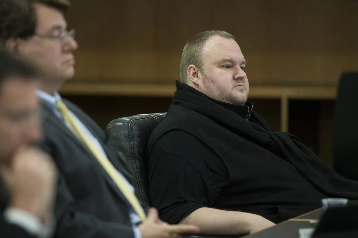 Kim Dotcom sits in the Auckland District Court during an extradition hearing in Auckland, New Zealand, on Sept. 21, 2015. The much-delayed extradition hearing for Doctom and three others who owned or helped run the website Megaupload began in Auckland this week in a case that could have broader implications for Internet copyright rules. (Jason Oxenham/New Zealand Herald via AP)