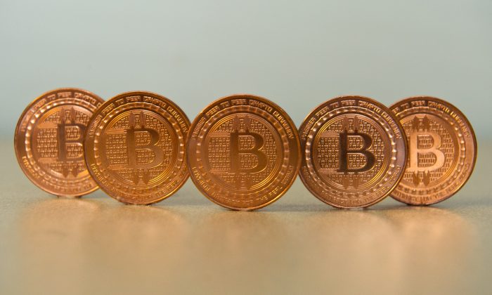 Bitcoin uses peer-to-peer technology to operate with no central authority or banks; managing transactions and the issuing of bitcoins is carried out collectively by the network. (Karen Bleier/AFP/Getty Images)