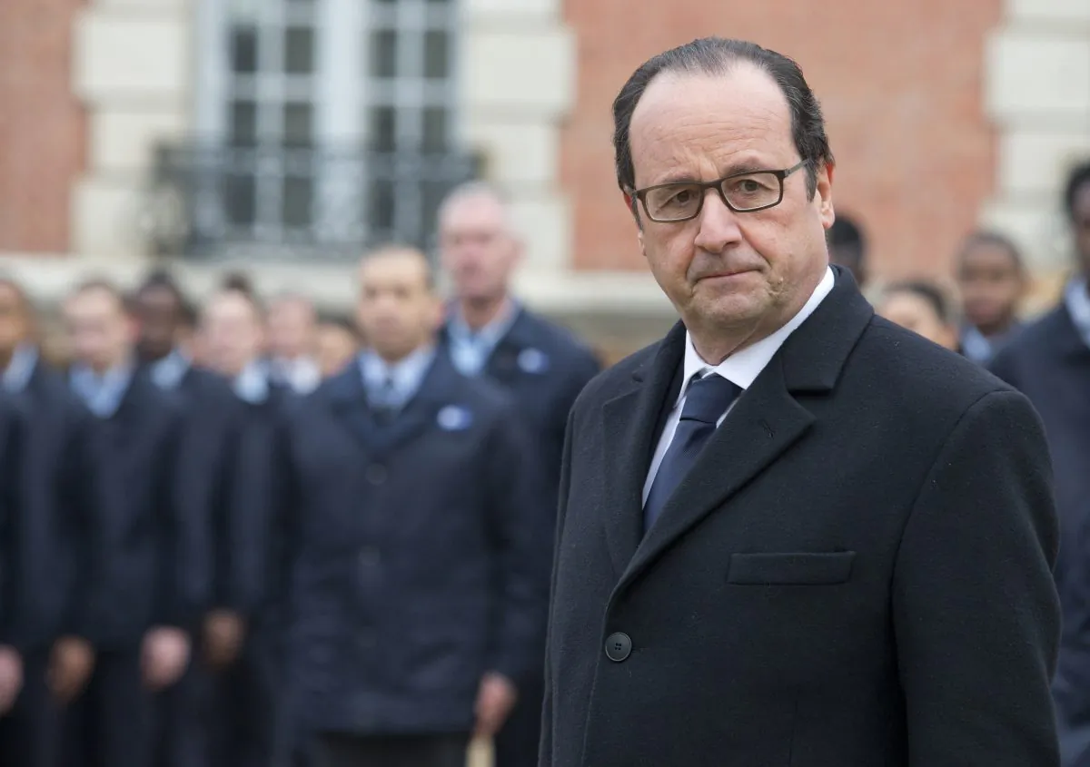 French President Francois Hollande visits a public center for insertion of the Defense (EPIDE) in Montry, France, on Feb. 16, 2015. (AP Photo/Jacques Brinon)
