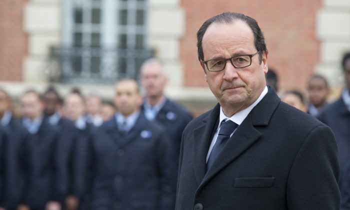 French President Francois Hollande visits a public center for insertion of the Defense (EPIDE) in Montry, France, on Feb. 16, 2015. (AP Photo/Jacques Brinon)