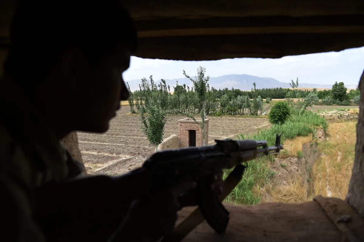 In this photograph taken on May 23, 2015, an Afghan Local Police (ALP) member keeps watch in Kasab village in Kunduz. (Shah Marai/AFP/Getty Images)