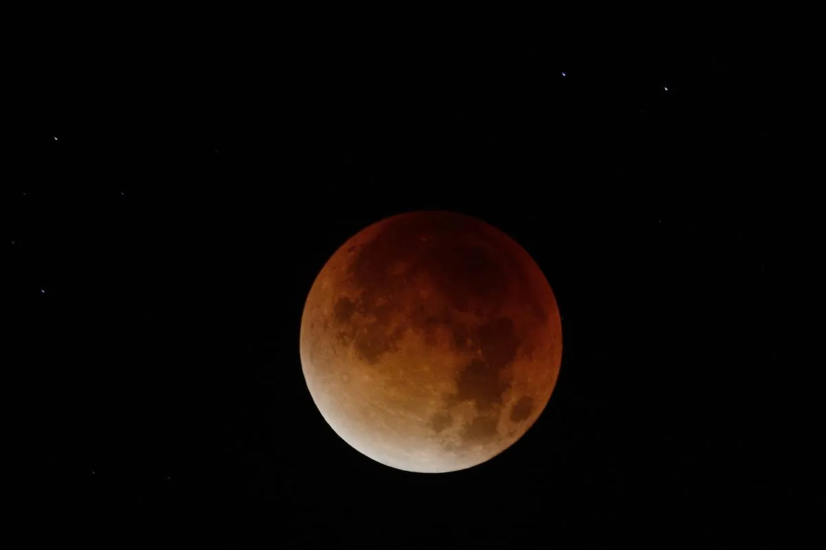 The blood-red light of a total eclipse seen in Nantes, western France, on September 28, 2015. (JEAN-SEBASTIEN EVRARD/AFP/Getty Images)