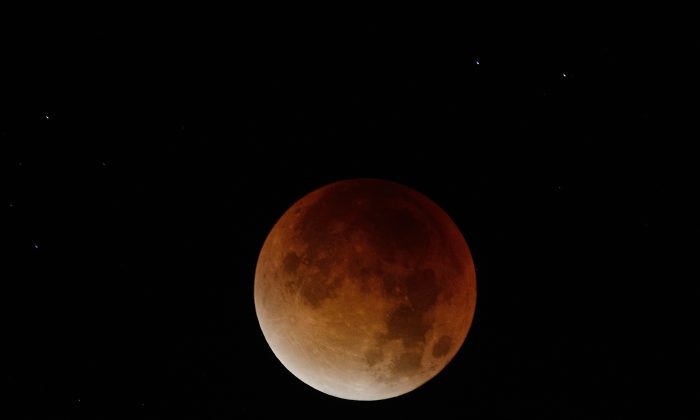 The blood-red light of a total eclipse seen in Nantes, western France, on September 28, 2015. (JEAN-SEBASTIEN EVRARD/AFP/Getty Images)