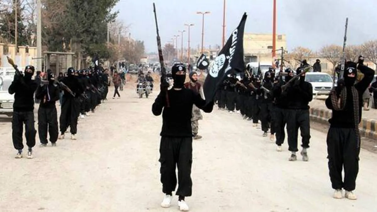ISIS terrorists parade down a street in Raqqa, Syria, on Jan. 14, 2014. (ISIS Website via AP)