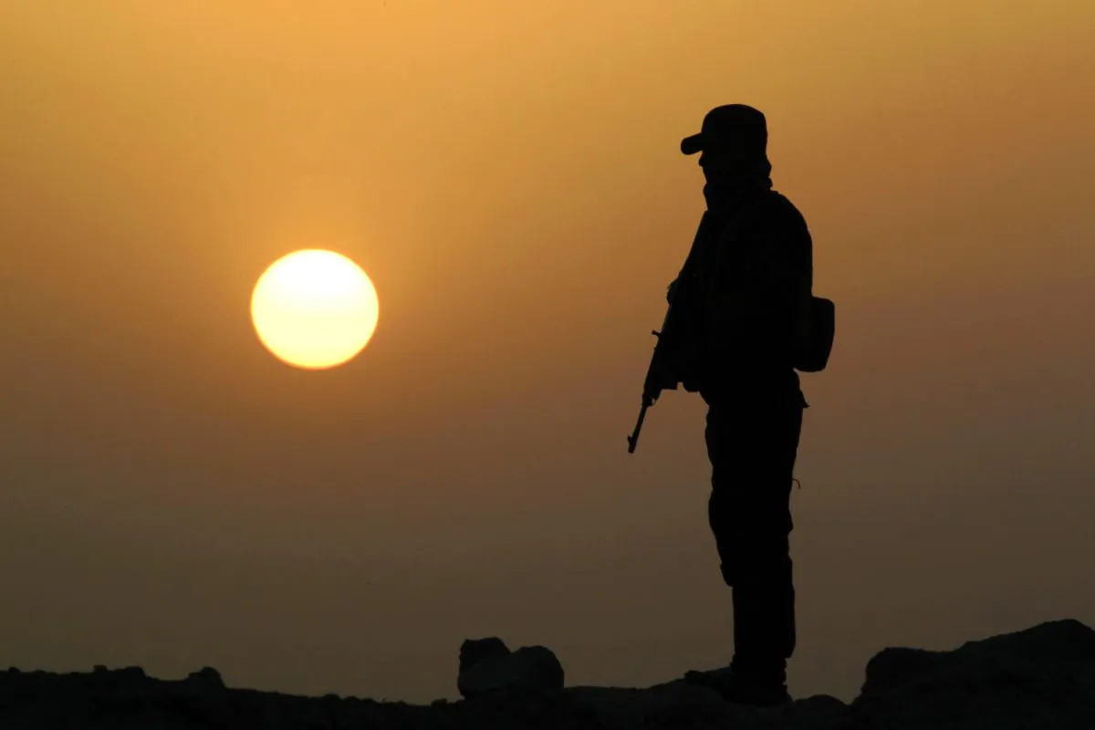 An Iraqi Sunni, former ISIS jihadist, takes position in Amriyat al-Fallujah, Iraq, on May 26, 2015. (Haidar Mohammed Ali/AFP/Getty Images)