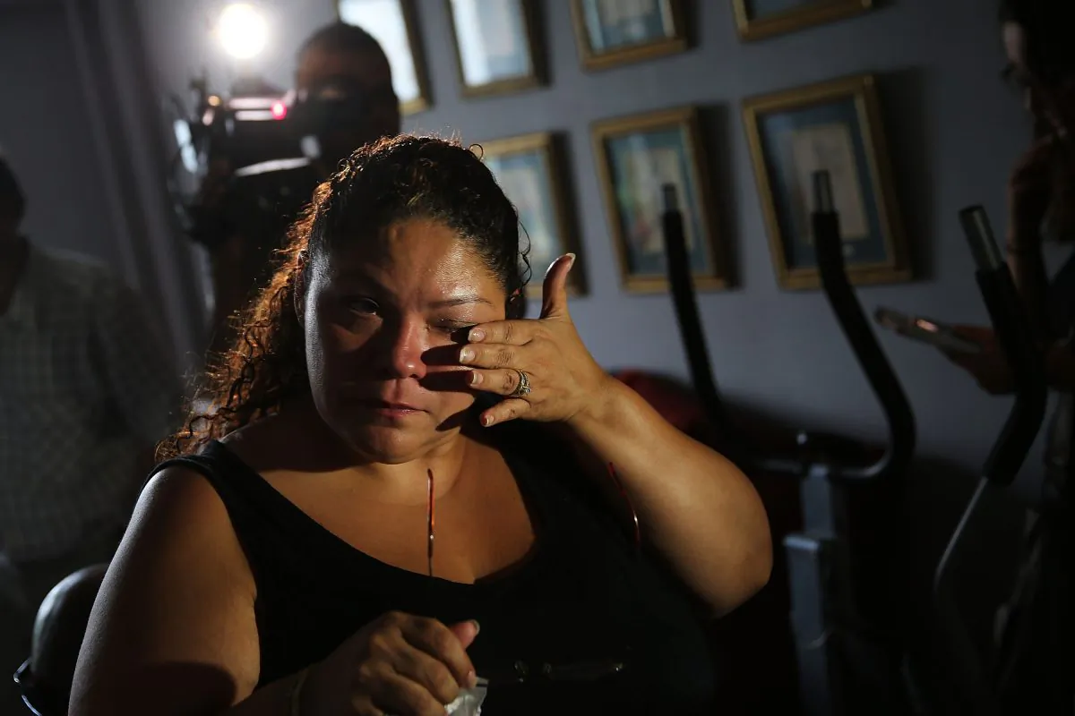 Carmen Ramirez, whose father Carmelo Quiles recently died of Legionnaires disease, pauses in her mothers apartment in an area of the Bronx which is the center of the outbreak on August 6, 2015 in New York City. (Spencer Platt/Getty Images)