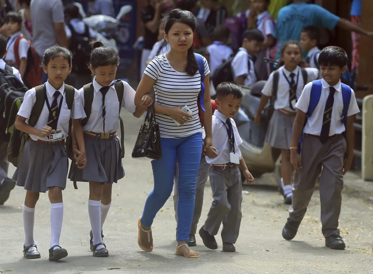 Children walk home from school in Dimapur, India, on Aug. 4, 2015. The Lucky Iron Fish, developed by a student at Guelph University, has been used extensively in parts of Asia to reduce anemia. It was showcased at a marketplace on sustainable innovation and development held during the U.N. General Assembly earlier this week. (AP Photo/Sorei Mahong)