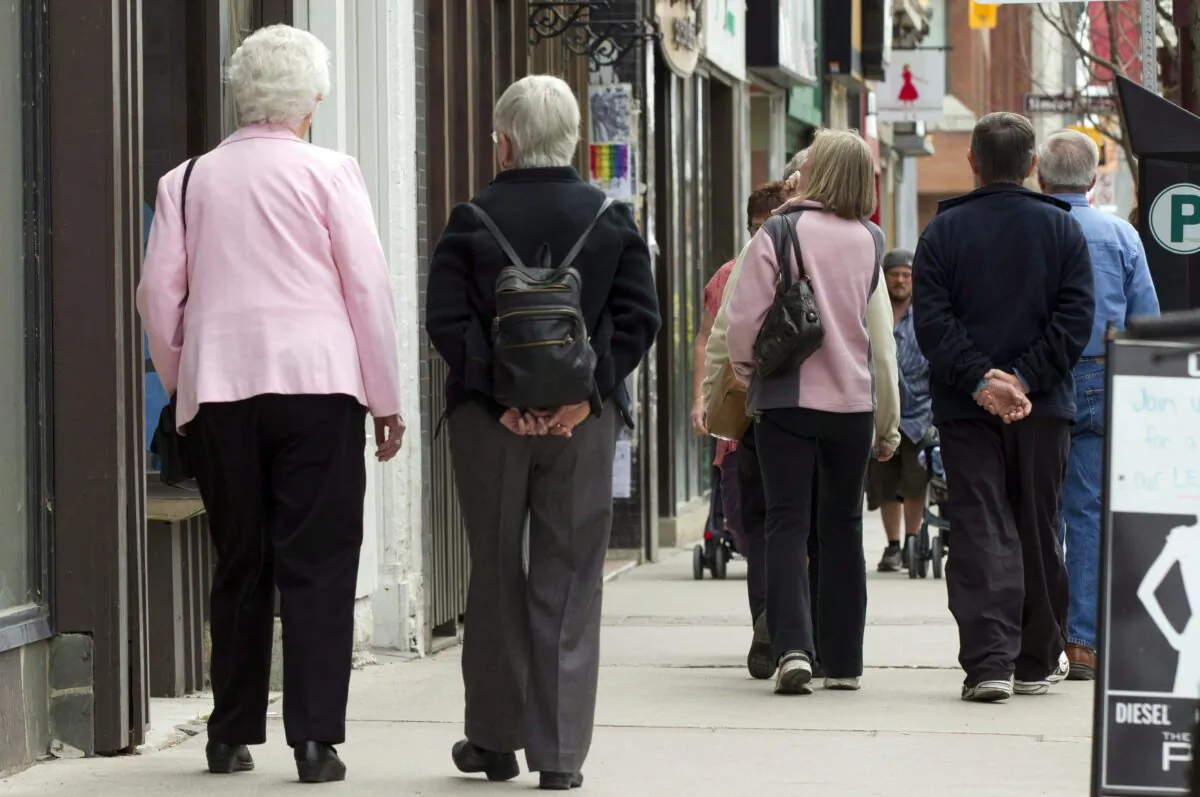 Senior citizens make their way down a street in Peterborough, Ont., on May 7, 2012. (The Canadian Press/Frank Gunn)