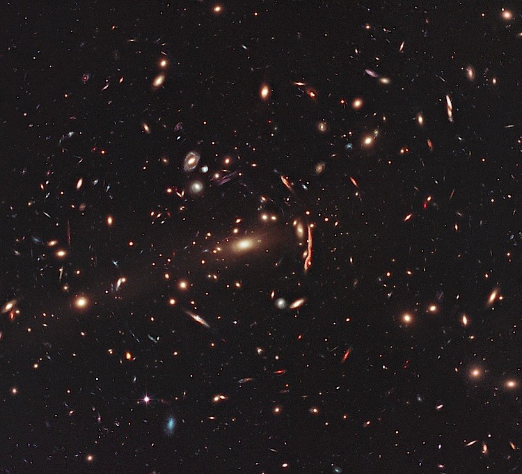 Hubble Space Telescope image showing the galaxy cluster MACS J1206, one of 25 clusters being studied as part of the CLASH program, a major project to build a library of scientific data on lensing clusters. (NASA, ESA, M. Postman/STScI, CLASH)