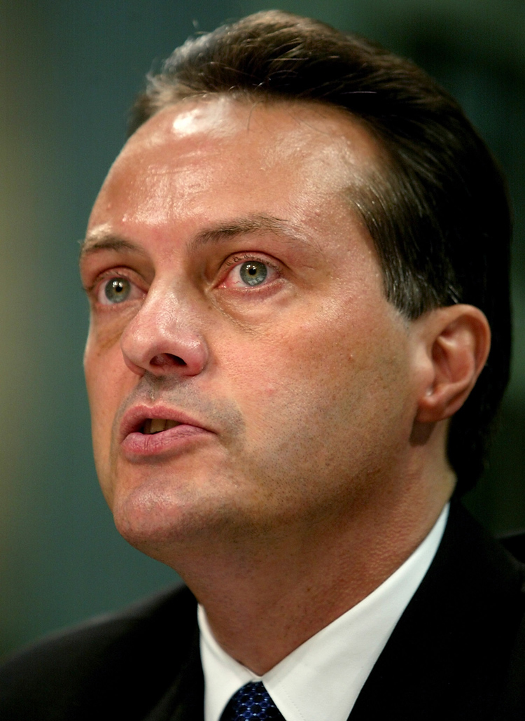 Global Crossing CEO John Legere testifies before t Epoch Times Photo