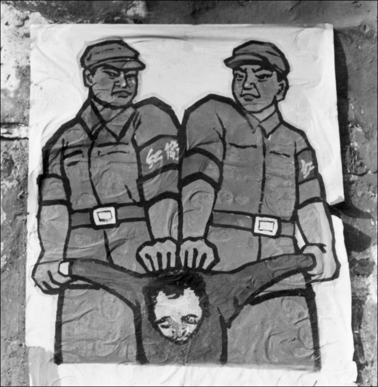 This poster, displayed in late 1966 in Beijing, shows how to deal with a so-called 'enemy of the people' during the Cultural Revolution. (Jean Vincent/AFP/Getty Images)