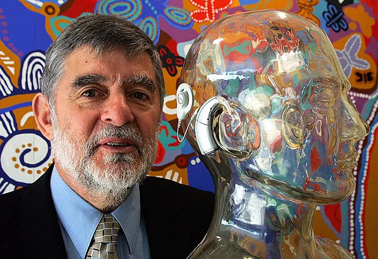 BIONIC EAR: Jim Patrick, the chief scientist of the Australian hearing implant technology company Cochlear, displays the new Nucleus Freedom bionic ear on a polymer model in Sydney, 26 May 2005. The technological breakthrough of the Nucleus Freedom implant, which is driven by four extremely powerful tiny computers, allows those who are born deaf to hear clearly. (TORSTEN BLACKWOOD/AFP/Getty Images)