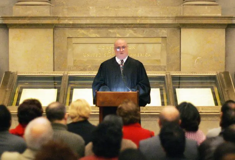 Royce C. Lamberth, acting chief judge of the District Court for the District of Columbia, speaks after giving the oath of allegiance to new citizens during a naturalization ceremony at the National Archives Rotunda in Washington, on Dec. 15, 2005. (Tim Sloan/AFP via Getty Images)