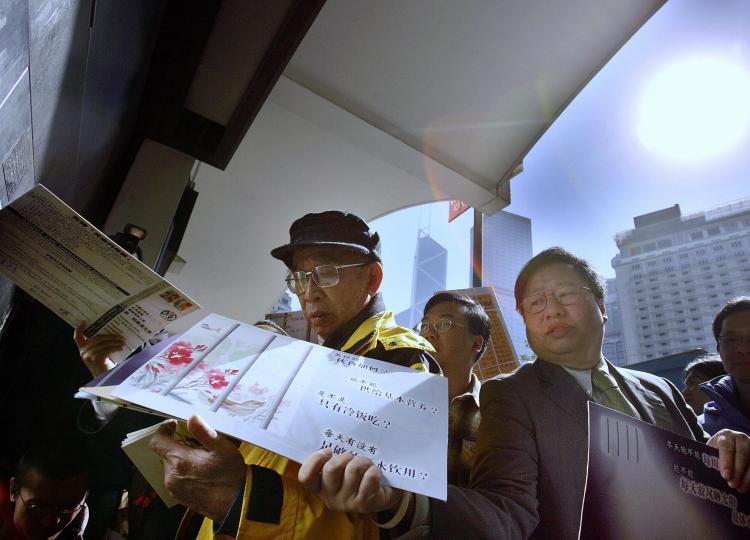 Hong Kong pro-democracy activists carry collected 3,000 Christmas cards and 2,000 post cards to mail out in Hong Kong, December 22, 2005. The Christmas and post cards were sent to Beijing for victims of June 4 Tiananmen Square massacre. (Samantha Sin/Getty Iamges ) Hong Kong pro-democracy activists carry collected 3,000 Christmas cards and 2,000 post cards to mail out in Hong Kong, December 22, 2005. The Christmas and post cards were sent to Beijing for victims of June 4 Tiananmen Square massacre. (Samantha Sin/Getty Iamges )