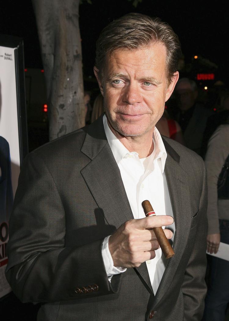 Actor William H. Macy holds a cigar as he arrives at the premiere of Fox Searchlight 'Thank You For Smoking' at the Directors Guild of America in March 2006 in Los Angeles. Health organizations in both Canada and the U.S. want the film industry to cut smoking scenes from youth-rated films.  (Kevin Winter/Getty Images)