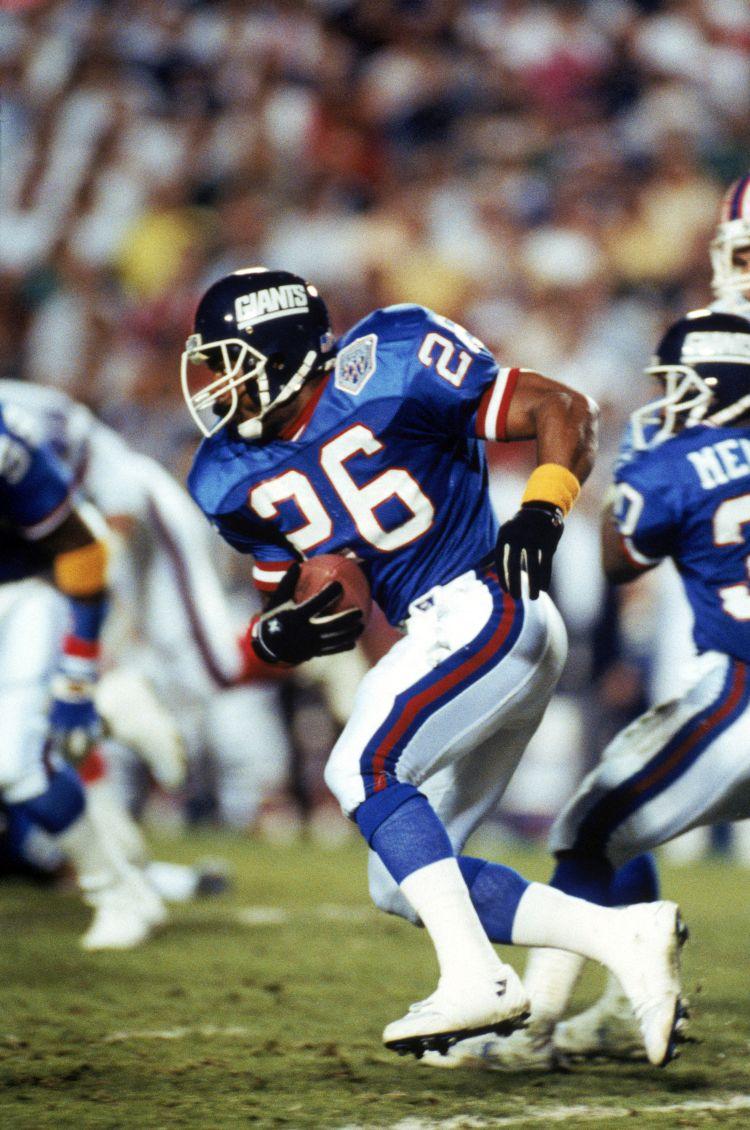 TAMPA, FL - JANUARY 27: Kick returner Dave Duerson #26 of the New York Giants carries the ball against the Buffalo Bills during Super Bowl XXV at Tampa Stadium on January 27, 1991 in Tampa, Florida. (George Rose/Getty Images) TAMPA, FL - JANUARY 27: Kick returner Dave Duerson #26 of the New York Giants carries the ball against the Buffalo Bills during Super Bowl XXV at Tampa Stadium on January 27, 1991 in Tampa, Florida. (George Rose/Getty Images)