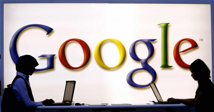 Google both at the Frankfurt Book Fair. Today Google's net income in the first quarter rose 37 percent to $1.96 billion ($6.06 per share), from $1.42 billion ($4.49). (TORSTEN SILZ/AFP/Getty Images) Google both at the Frankfurt Book Fair. Today Google's net income in the first quarter rose 37 percent to $1.96 billion ($6.06 per share), from $1.42 billion ($4.49). (TORSTEN SILZ/AFP/Getty Images)