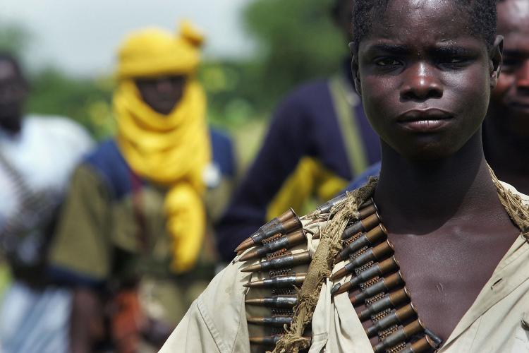 A rebel Sudanese Justice and Equality Movement (JEM) fighter stands at his base near the Chad border in the Darfur region of Sudan on Sept. 7, 2004, in Misterei, Sudan. Violence between Jem and the Sudanese forces escalated this past weekend. (Scott Nelson/Getty Images) A rebel Sudanese Justice and Equality Movement (JEM) fighter stands at his base near the Chad border in the Darfur region of Sudan on Sept. 7, 2004, in Misterei, Sudan. Violence between Jem and the Sudanese forces escalated this past weekend. (Scott Nelson/Getty Images)