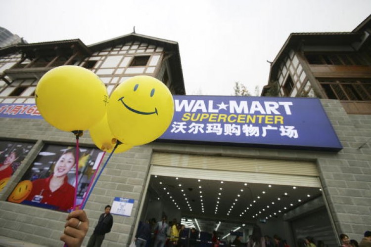 Promotional balloons are held outside Chongqing's second Wal-Mart store, which opened on Nov. 16, 2006 in Chongqing, China. (China Photos/Getty Images) Promotional balloons are held outside Chongqing's second Wal-Mart store, which opened on Nov. 16, 2006 in Chongqing, China. (China Photos/Getty Images)