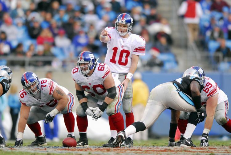READY TO RUMBLE: Quarterback Eli Manning and the New York Giants will take on the Carolina Panthers this Sunday night for a chance to win home-field advantage throughout the NFC playoffs. (Grant Halverson/Getty Images) READY TO RUMBLE: Quarterback Eli Manning and the New York Giants will take on the Carolina Panthers this Sunday night for a chance to win home-field advantage throughout the NFC playoffs. (Grant Halverson/Getty Images)