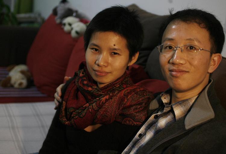 Human rights activists Hu Jia (R) and his wife Zeng Jinyan (L) during their house arrest, monitored by police and internal security police, in their housing complex ironically named Bobo Freedom City. (Frederic J. Brown/AFP/Getty Images) Human rights activists Hu Jia (R) and his wife Zeng Jinyan (L) during their house arrest, monitored by police and internal security police, in their housing complex ironically named Bobo Freedom City. (Frederic J. Brown/AFP/Getty Images)