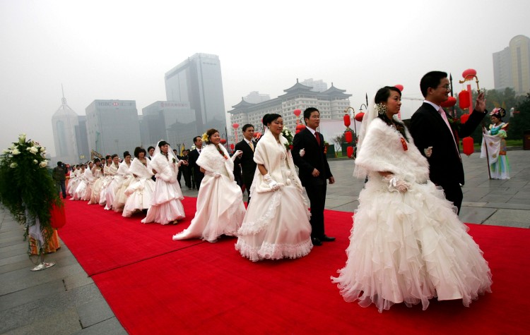 China's new marriage law amendment is controversial for favoring men and not protecting women by law. (AFP/Getty Images) China's new marriage law amendment is controversial for favoring men and not protecting women by law. (AFP/Getty Images)
