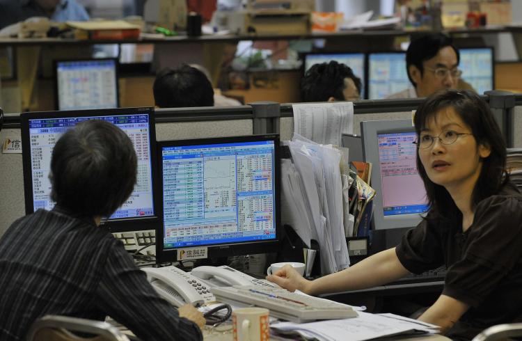 Traders at a brokerage in Hong Kong. Hong Kong ranked first among 118 nations for ease of cross-border trading and for being the most desirable trading and investment partners in international trade. (Mike Clarke/AFP/Getty Images) Traders at a brokerage in Hong Kong. Hong Kong ranked first among 118 nations for ease of cross-border trading and for being the most desirable trading and investment partners in international trade. (Mike Clarke/AFP/Getty Images)