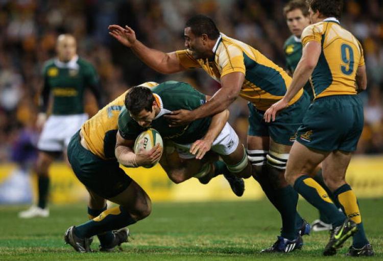 Pierre Spies of the South African Springboks gets tackled by the Australian Wallabies in the third of the Tri-Nations nine-match series. (Cameron Spencer/Getty Images) Pierre Spies of the South African Springboks gets tackled by the Australian Wallabies in the third of the Tri-Nations nine-match series. (Cameron Spencer/Getty Images)