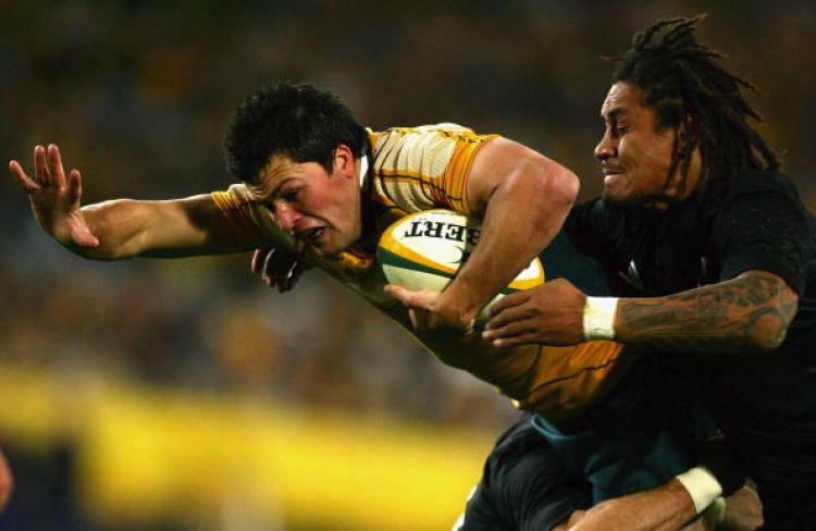 Deans� coached Australian team has won five-from-five�The Wallabies Adam Ashley-Cooper is tackled by the All Blacks� Rodney So�Oialo last Saturday night July 26. (Matt King/Getty Images) Deans� coached Australian team has won five-from-five�The Wallabies Adam Ashley-Cooper is tackled by the All Blacks� Rodney So�Oialo last Saturday night July 26. (Matt King/Getty Images)
