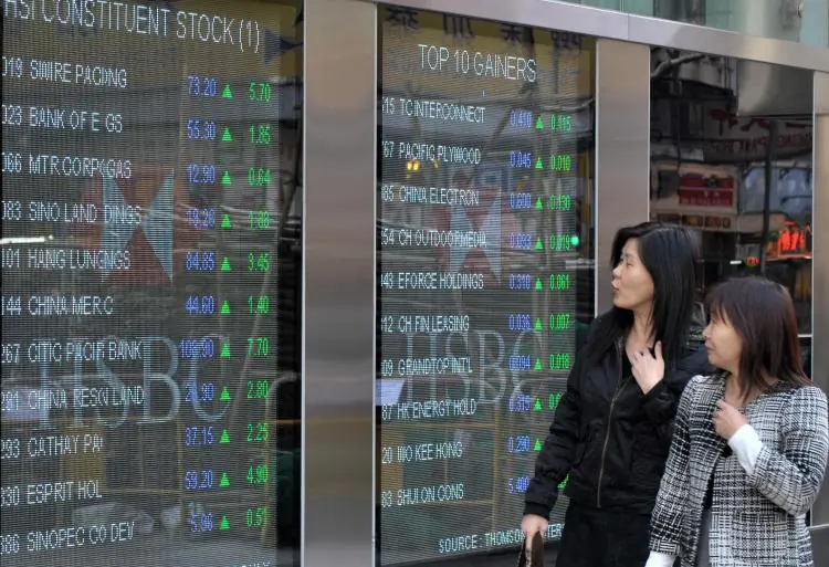A board displaying stock prices on the Hang Seng Index in Hong Kong. (Mike Clarke/AFP/Getty Images)