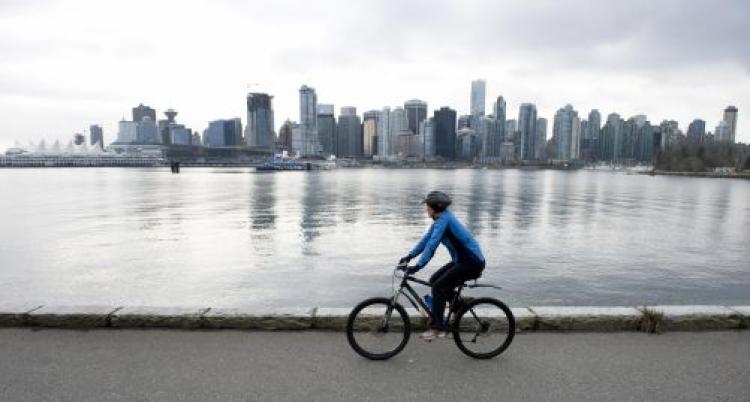 A cyclist rides in front of the skyline of Vancouver February 7, 2009 in Vancouver, British Columbia. (Don Emmert/AFP/Getty Images) A cyclist rides in front of the skyline of Vancouver February 7, 2009 in Vancouver, British Columbia. (Don Emmert/AFP/Getty Images)