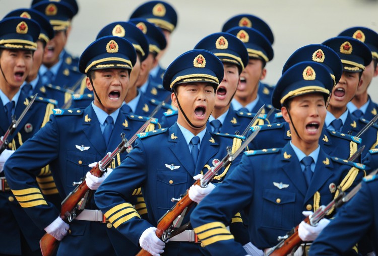 Chinese military honour guards from the Chinese navy guards yell as they march in Beijing in 2009. The military question in the context of Bo Xilai's political drama remains inconclusive. (Frederic J. Brown/AFP/Getty Images)