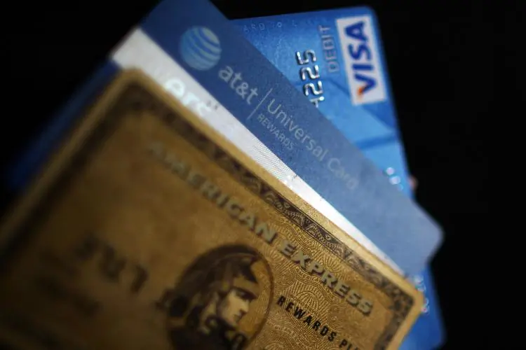 Credit cards are widening the gap between the rich and poor. A study says that credit cards often make the wealthy wealthier and those who are less fortunate more in debt. (Spencer Platt/Getty Images)