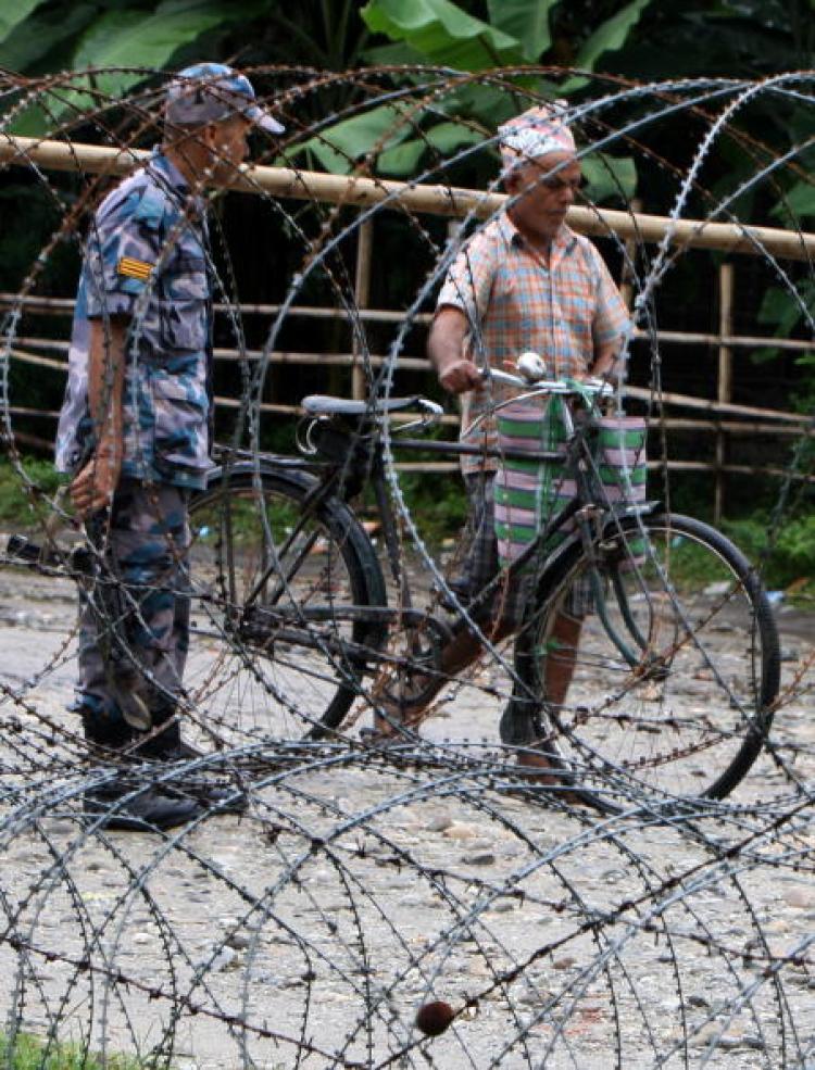 Nepalese police guard the entrance to The Beldangi II Refugee Camp some south-east of Kathmandu. (Prakash Mathema/AFP/Getty Images) Nepalese police guard the entrance to The Beldangi II Refugee Camp some south-east of Kathmandu. (Prakash Mathema/AFP/Getty Images)