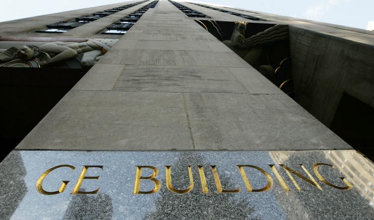 The General Electric Co. headquarters at the Rockefeller Center. GE will order electric vehicles in the tens of thousands, according to the company CEO. (Chris Hondros/Getty Images) The General Electric Co. headquarters at the Rockefeller Center. GE will order electric vehicles in the tens of thousands, according to the company CEO. (Chris Hondros/Getty Images)