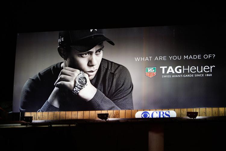 A TAG Heuer watch billboard with an image of Tiger Woods is shown on Dec. 11 in Los Angeles, California. Woods announced that he will take an indefinite break from professional golf to concentrate on repairing family relations after admitting to infidelit (David McNew/Getty Images)
