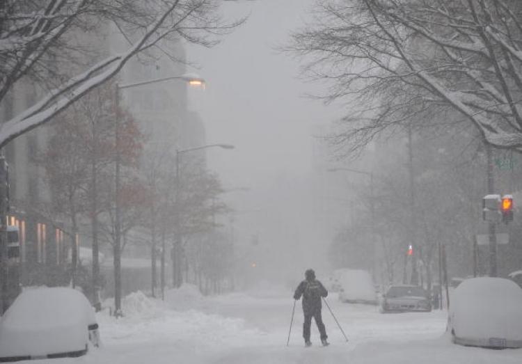A skier makes his way down a snow-covered street December 19, 2009 in Washington, DC.  (Mandel Ngan/AFP/Getty Images)