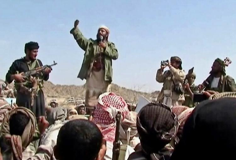 A man claiming to be an al-Qaeda member addresses a crowd gathered in Yemen's southern province of Abyan on Dec. 22. The U.S. is increasing aid to Yemen to help its government combat the terrorists. (AFP/Getty Images)