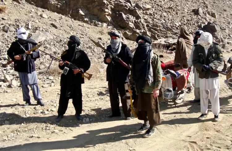 Taliban fighters stand alert during a patrol in Ghazni Province, Afghanistan, on Jan. 23, 2010. (STR/Getty Images)