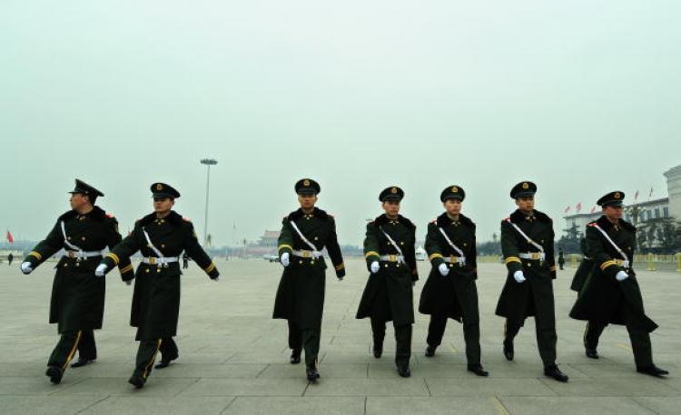 Chinese paramilitary police march in formation on Tiananmen Square, in Beijing, on March 11. (Frederic J. Brown/AFP/Getty Images)