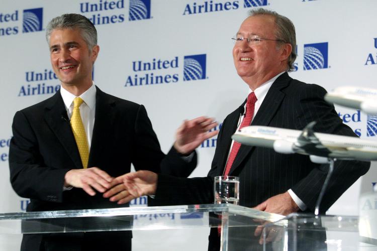 APPROVED: Glenn Tilton (R), chairman, president and CEO of United Airlines, and Jeff Smisek, CEO of Continental Airlines, smile after shaking hands during a press conference on May 3, 2010 in New York City announcing the company's merger plans. (Hiroko Masuike/Getty Images ) APPROVED: Glenn Tilton (R), chairman, president and CEO of United Airlines, and Jeff Smisek, CEO of Continental Airlines, smile after shaking hands during a press conference on May 3, 2010 in New York City announcing the company's merger plans. (Hiroko Masuike/Getty Images )
