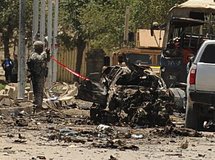 Afghan and foreign investigators inspect the site of a suicide car bomb in Kabul on May 18. The attack has targeted NATO troops in the Afghan capital, killing at least 20 people. It is the deadliest strike on Kabul in more than a year. (Shah Marai/Getty Images) Afghan and foreign investigators inspect the site of a suicide car bomb in Kabul on May 18. The attack has targeted NATO troops in the Afghan capital, killing at least 20 people. It is the deadliest strike on Kabul in more than a year. (Shah Marai/Getty Images)